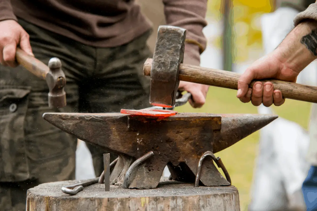 Blacksmith anvil with a hammer.